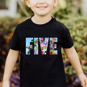 May include: Black t-shirt with the word "FIVE" spelled out in large letters. The letters are filled with images of Spider-Man and other Marvel characters.