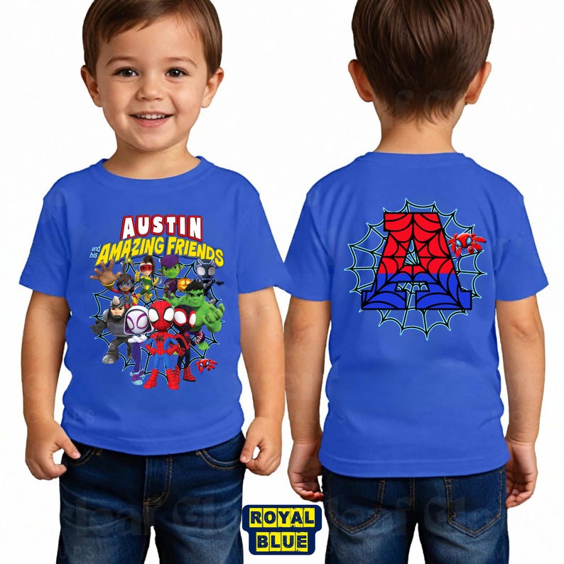 May include: A royal blue short-sleeved t-shirt featuring a graphic print of cartoon superheroes and the text "AUSTIN and his AMAZING FRIENDS" on the front, and a large letter "A" with a spiderweb design on the back.