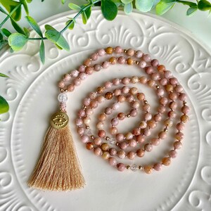 Sakura Mala Necklace -108 beads hand-knotted mala with sakura chalcedony, clear quartz,  silk tassel and gold-plated veil eye charm