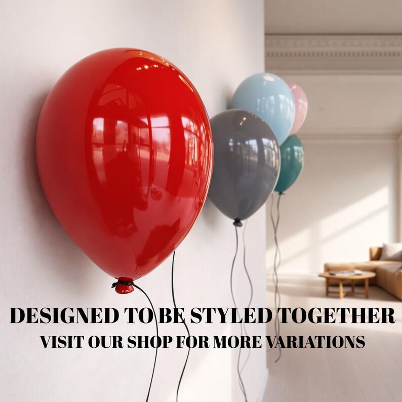 May include: A collection of glossy, round balloons in red, grey, light blue, teal, and soft pink, attached to thin black strings. The text "DESIGNED TO BE STYLED TOGETHER VISIT OUR SHOP FOR MORE VARIATIONS" is printed in black at the bottom.
