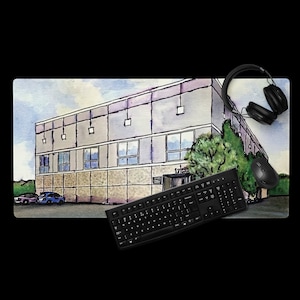 May include: A watercolor illustration of a building with a light gray exterior and a brown brick base. The building has a flat roof and several windows. There are trees in front of the building and a blue sky with white clouds in the background. The illustration is on a white background.