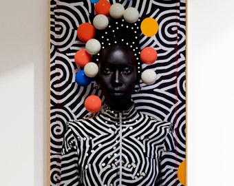 May include: A black and white portrait of a person with a black and white patterned background. The person is wearing a black and white striped shirt and has a crown of colorful balls on their head.