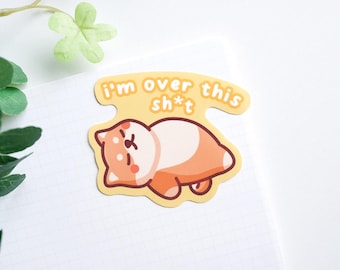 May include: A yellow sticker with a cartoon dog lying on its back. The sticker says "I'm over this sh*t".