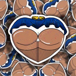 May include: A heart-shaped sticker featuring a cartoon illustration of a derriere. The design includes a blue top with a yellow bow, brown skin tone, and fishnet stockings. The sticker has a white border and a glitter effect.