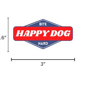 May include: A blue and red diamond-shaped sticker with the text "BITE HARD" at the top and "HAPPY DOG" in white letters on a red background.