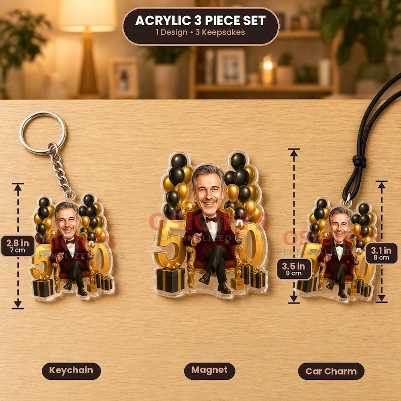 May include: An acrylic 3-piece set featuring a keychain, magnet, and car charm with a cartoon illustration of a person in a suit sitting on a chair with balloons and the number 50. The keychain is 7 cm, and the car charm is 8 cm tall.