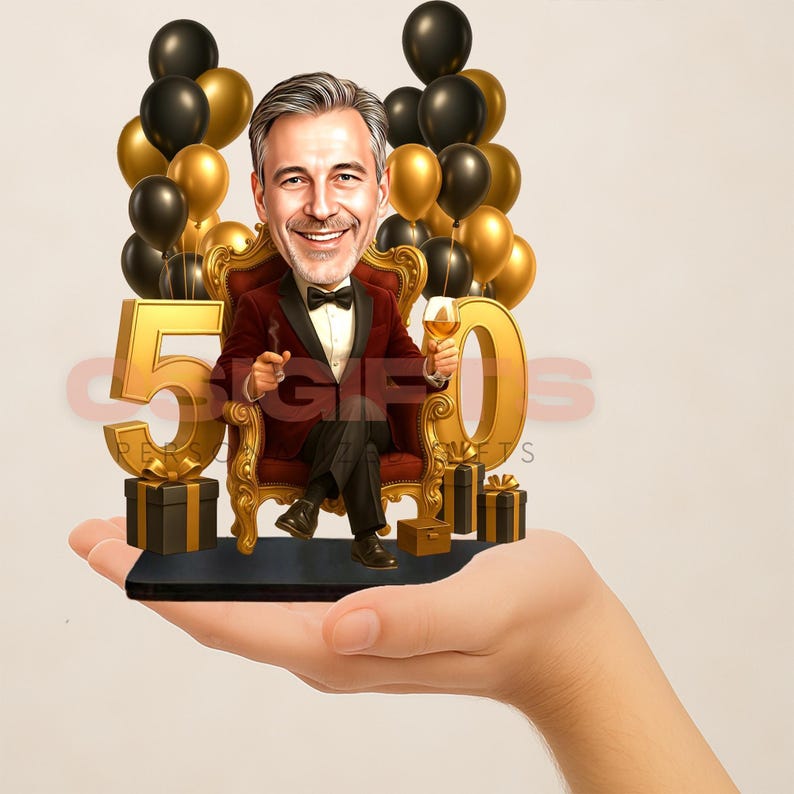 A hand holding a small figurine of a man wearing a tuxedo, surrounded by gold and black balloons and gift boxes.