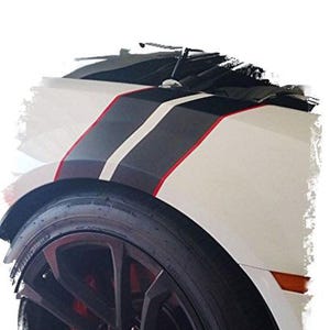 May include: White car with black, gray, and red racing stripes. The car has a black tire and a dark gray wheel. The wheel has red brake calipers. The car's body is white.