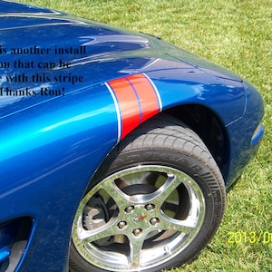 May include: Close-up of a blue sports car with a red and white stripe detail on the front fender. The text on the car says, "this is another install option that can be done with this stripe set. Thanks Ron!"