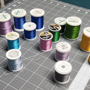 Madera Rayon thread, Signature and Coats Rayon thread; small spools 200m large spools 1000m. most lightly used/not new