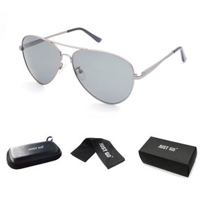 May include: Silver aviator sunglasses with gray lenses, a black microfiber cleaning cloth, and a black hard case with the text "JUST GO" printed on it.