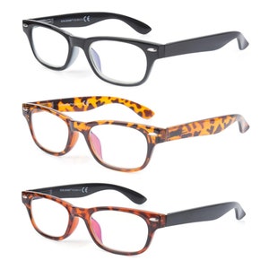 May include: Three pairs of reading glasses with rectangular frames. One pair is black, another has a tortoiseshell pattern, and the third has a tortoiseshell frame with black arms. All have clear lenses.