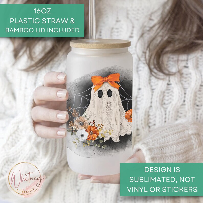 May include: A 16 ounce clear glass tumbler with a bamboo lid and a plastic straw. The tumbler features a ghost design with a lace overlay and orange ribbon. The design is sublimated, not vinyl or stickers.