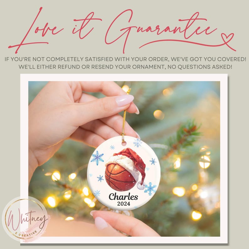 May include: A white ceramic Christmas ornament with a basketball wearing a Santa hat. The ornament has blue snowflakes and the text "Charles 2024".