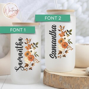 May include: Two frosted glass tumblers with a floral design and the name Samantha on them. The tumblers are on a wooden surface. The text "FONT 1" and "FONT 2" are on the image.