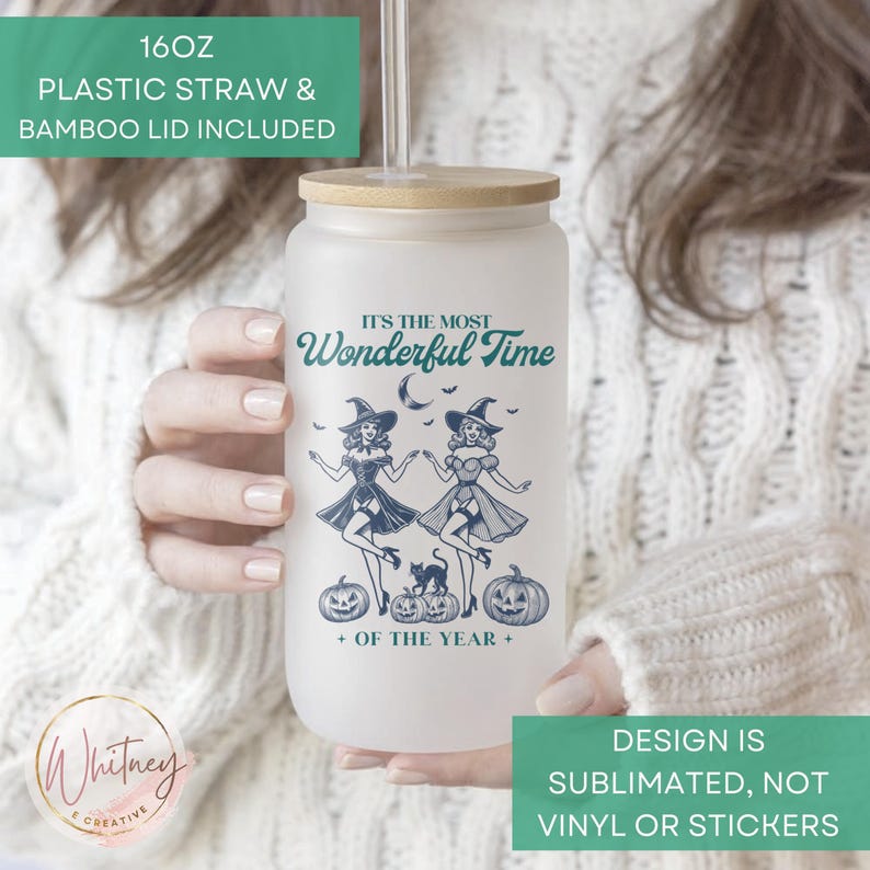 May include: A frosted glass 16 ounce tumbler with a bamboo lid and a plastic straw. The tumbler features a design of two witches with the text "It's the most Wonderful Time of the Year".