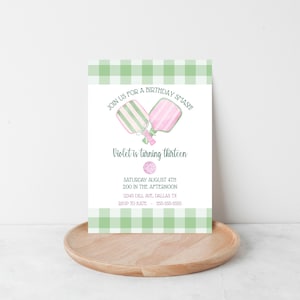 May include: A birthday invitation with a green and white gingham border. The invitation features two pickleball paddles and the text "Join us for a birthday smash!" and "Violet is turning thirteen". Details include the date, time, and RSVP information.