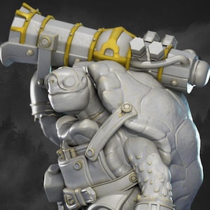 May include: A detailed, grey figurine of a turtle-like creature carrying a large, ornate weapon with gold detailing. The figure is on a black base, with a forest backdrop. Etsy and Patreon logos are visible.