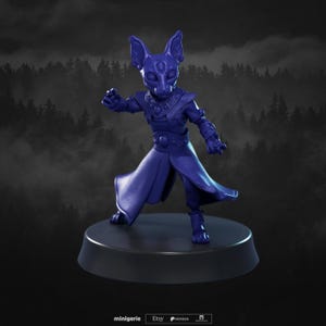 May include: A detailed, indigo-colored figurine of a cat-like humanoid character in a dynamic pose. The figure is wearing ornate armor and a flowing robe, standing on a black circular base. The background features a blurred forest scene.