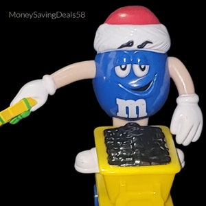 Mars. Inc 1990s 3.5&quot; Blue M&M Santa Hat Holding a Gift &quot;Riding a Coal Cart&quot; Series 1 Cart 6 Plastic Christmas Figurine Collectible Vintage