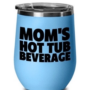 May include: A light blue stainless steel wine tumbler with a black inscription that reads "Mom's Hot Tub Beverage".