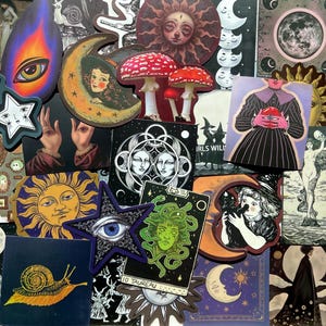 May include: A collection of various stickers with mystical and celestial themes. The stickers feature illustrations of moons, stars, eyes, mushrooms, tarot cards, and other occult imagery. The color palette includes blues, purples, oranges, and greens.