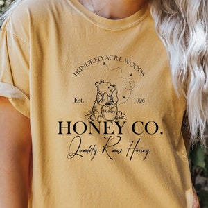 Comfort Colors Vintage Hundred Acre Woods Honey Co. Shirt,Classic Pooh Bear Shirt, Disneyland shirt  Winnie The Pooh est 1926 Shirt,