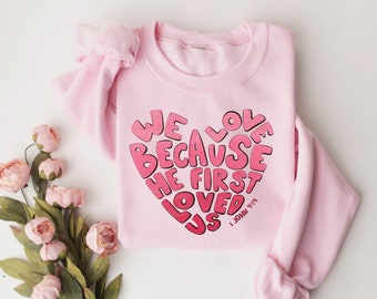 we love because he first loved us sweatshirt, Valentine sweatshirt,heart shirt,gift for valentina,Christian Sweatshirt Gift,Bible shirt