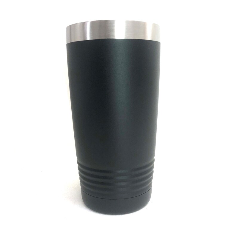 May include: A black stainless steel tumbler with a silver lid. The tumbler has a textured bottom and a smooth, matte finish.