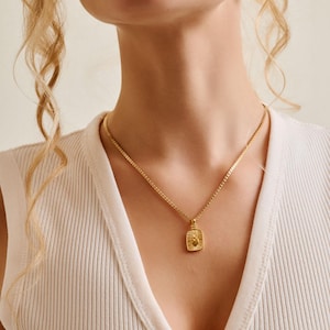 Rectangular mexican heart pendant wt gold sequin-crossed chain