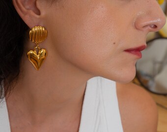 Large gold dangling heart stud earrings