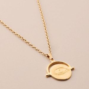 Gold vintage-style evil eye protection engraved pendant