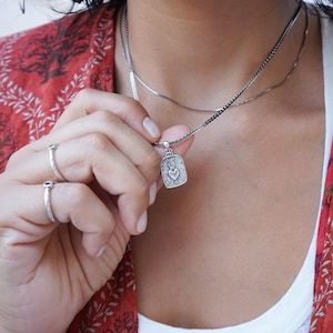 Rectangular mexican heart pendant with silver sequin crossed chain