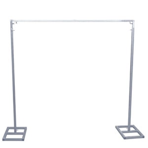 May include: A silver metal backdrop stand with two adjustable legs and a horizontal bar. The stand is made of sturdy metal and is designed to hold backdrops for photography or events.