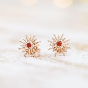 Starlight Elegance: Ruby Starburst Stud Earrings