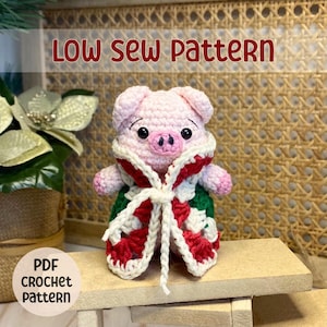 May include: A crochet pattern for a pink pig wearing a red and white crocheted coat. The pattern is available as a PDF download. The text "LOW SEW PATTERN" is displayed above the pig and the text "PDF CROCHET PATTERN" is displayed below the pig.