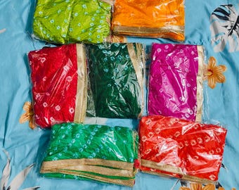 May include: Six colorful fabric squares with gold trim, packaged in clear plastic. The squares are in shades of green, orange, red, pink, and blue.