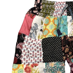 May include: Patchwork shorts with a variety of floral and geometric patterns in pink, green, blue, yellow, and black.