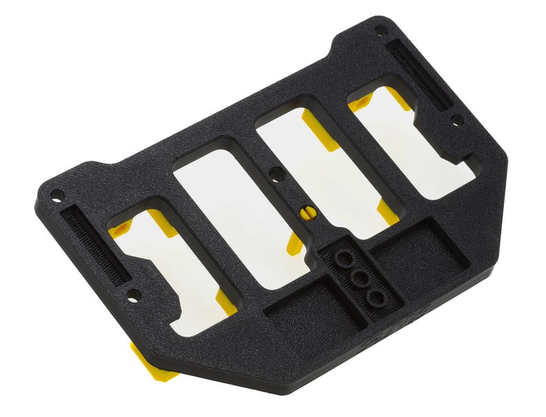 May include: Black plastic storage organizer with four slots and yellow dividers. The organizer has a textured surface and is designed to hold small items.