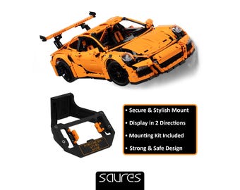 May include: An orange model Porsche 911 GT3 RS car with black wheels and a rear spoiler. Below is a black mounting bracket with orange accents. Text on the bracket reads "PORSCHE 911 GT3 RS 42056".