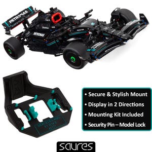 Puede incluir: Un modelo de coche de carreras Mercedes-AMG F1 W14 E 42171 negro con la marca Petronas. Incluye un soporte de exhibición negro y verde azulado. El texto dice "Secure & Stylish Mount" y "Display in 2 Directions".