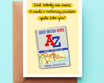 May include: A pale yellow greeting card featuring a spiral-bound road atlas illustration with the text: Dad, nobody can name A roads + motorway junctions quite like you! The atlas cover reads: GREAT BRITISH ROADS A-Z HAPPY FATHER'S DAY MENTAL ROAD ATLAS.