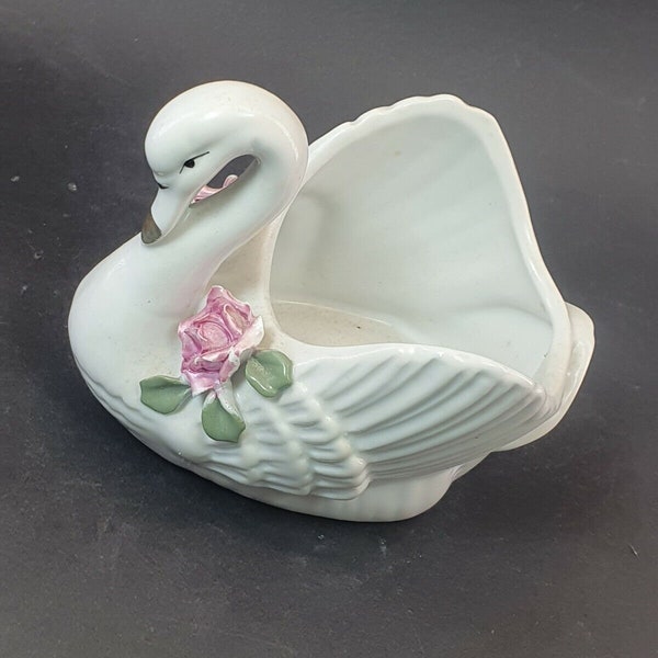 Beautiful vase flower vase in the shape of a swan made of porcelain