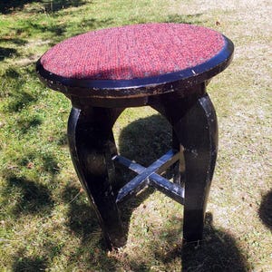 Old elegant stool in Japanese style made of black lacquered wood, height 45 cm.