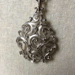 TRIFARI pendant necklace satin and shiny silvertone scrollwork