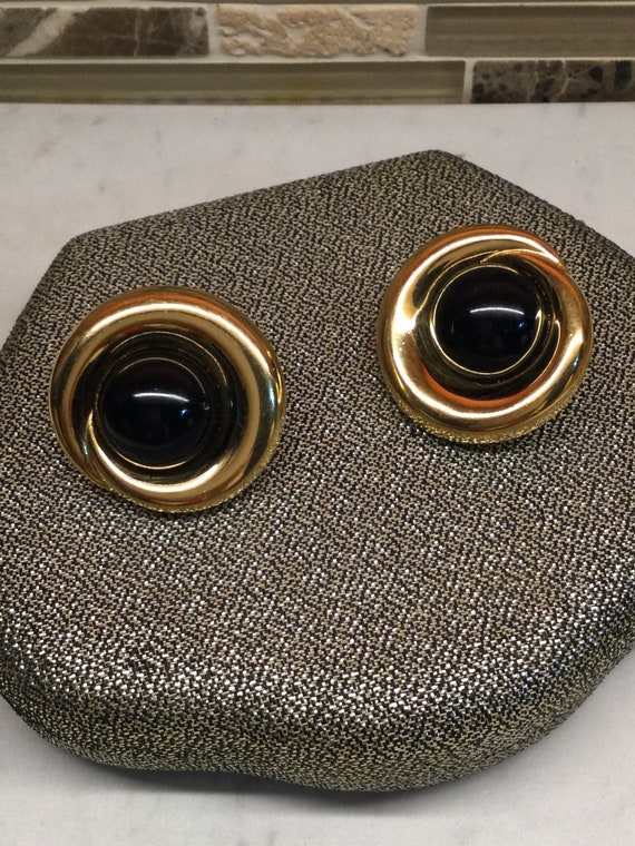 Large round MONET earrings.  Gold and black clip o