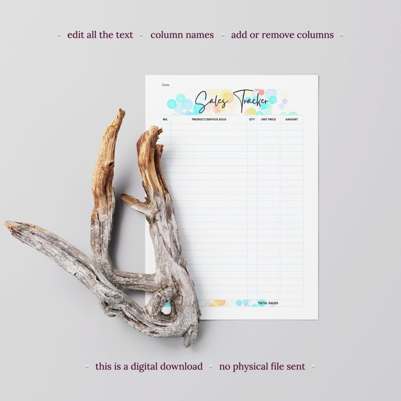 May include: A white sales tracker sheet with a colorful bubble design and the words "Sales Tracker" in script. The sheet includes columns for product/service sold, quantity, unit price, and amount. A piece of driftwood is in the foreground.