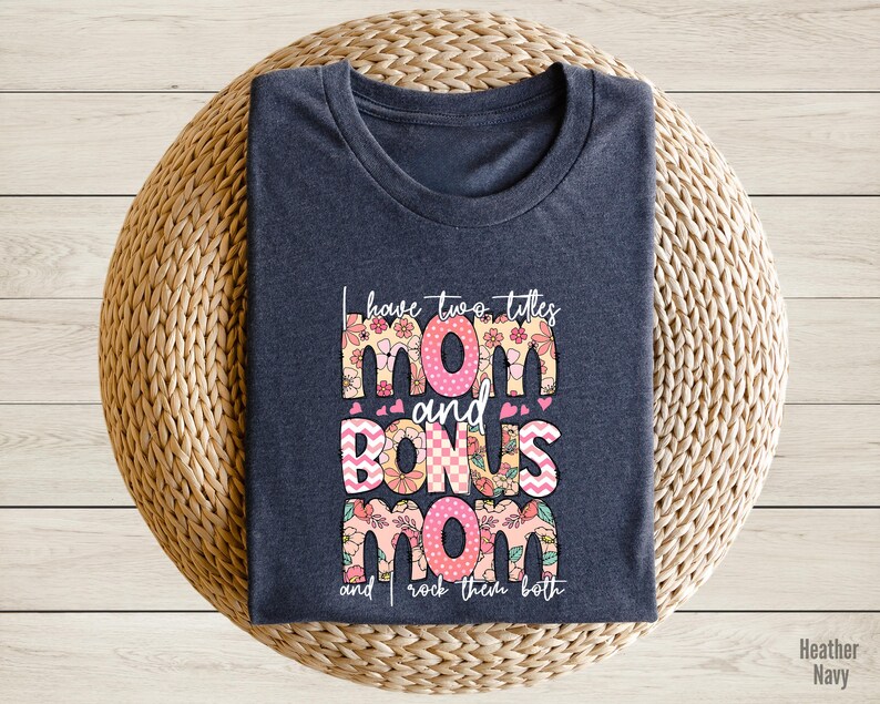 a t - shirt with the words mom and donuts mom printed on it
