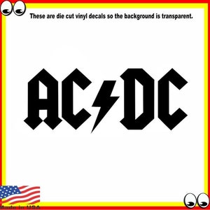 Puede incluir: Calcomanía de vinilo recortada en negro y blanco del logotipo de AC/DC con un rayo. El fondo es transparente.