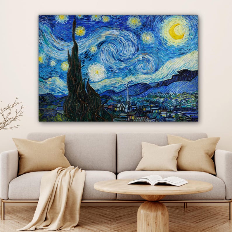 May include: A large canvas print of Van Gogh's "Starry Night" painting. The artwork features a swirling blue night sky with yellow stars and a crescent moon. A dark tree is in the foreground, with a village and mountains in the background.